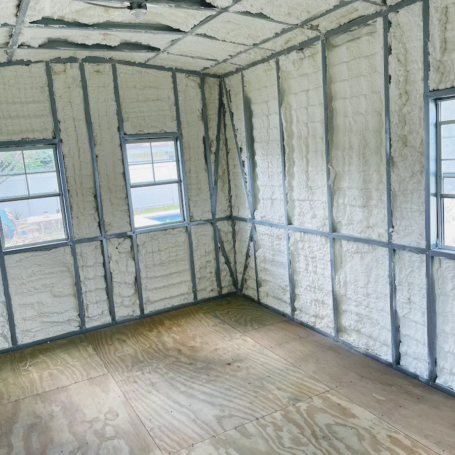 Closed-cell spray foam insulation applied to wall cavities in a residential project in Wixom