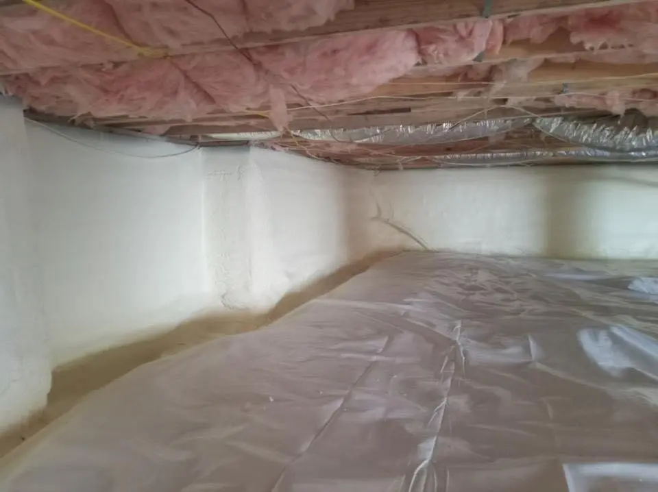 Crawl space encapsulation with closed-cell spray foam for Commercial Roof Restoration in Wixom